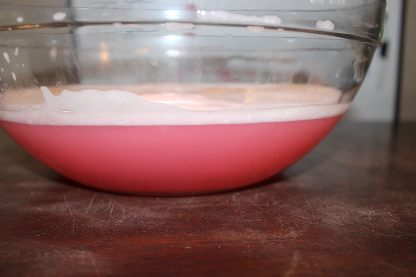 And in this photo is a picture of what the color of the water became once the waffle bath bomb was finished. It's a rich pinkish color. And there is a layer of foam on top of the water.