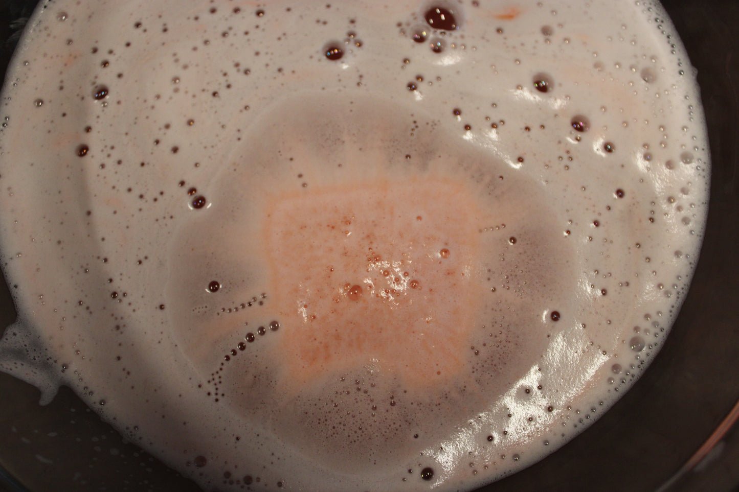 This is a picture of the waffle bath bomb in a small bowl of water. You can see by the picture that it is fizzing and foaming.