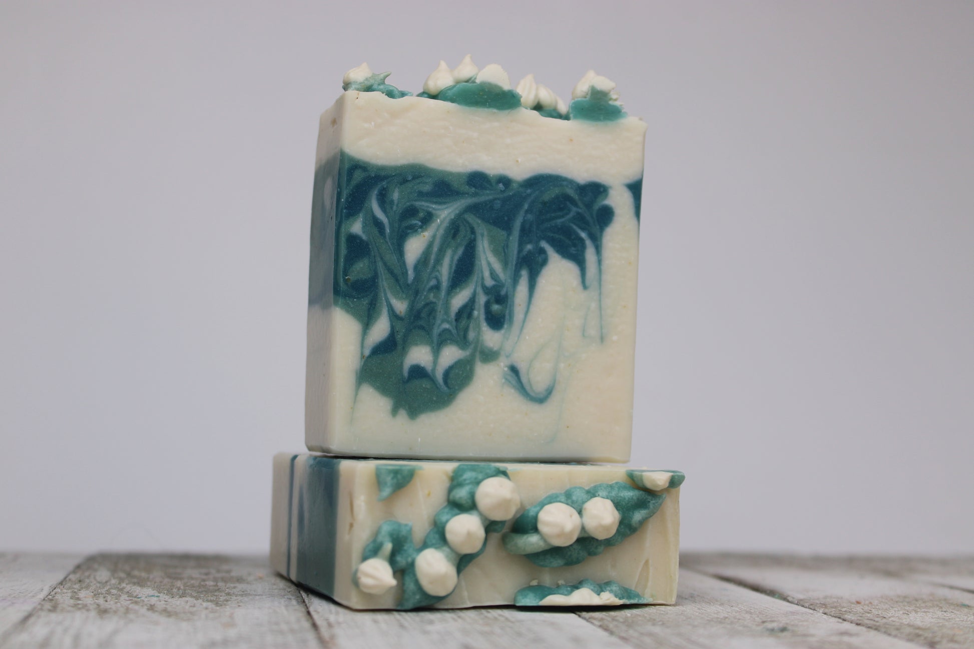 This gorgeous Lily of the Valley Soap has little white flowers piped on the top. The inside of this soap is two toned green swirls.